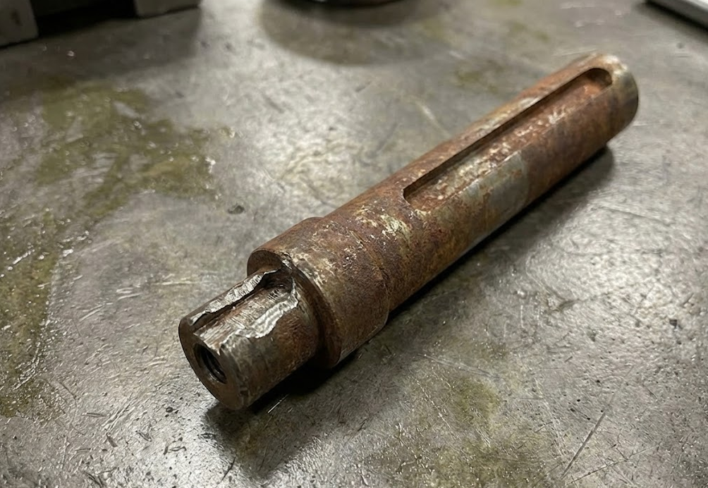 Rusty driveshaft on a workbench